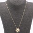 Collier boule en or avec diamants noirs sur anneau rotatif