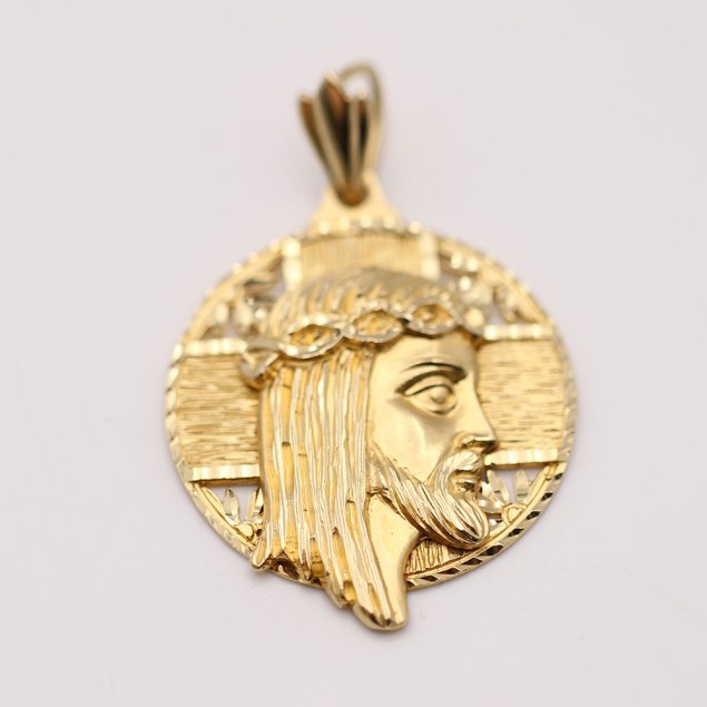 Pendentif profil du Christ en or...