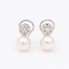 Boucles d'oreilles toi et moi en or, perles et diamants d'occasion