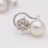 Boucles d'oreilles toi et moi en or, perles et diamants d'occasion