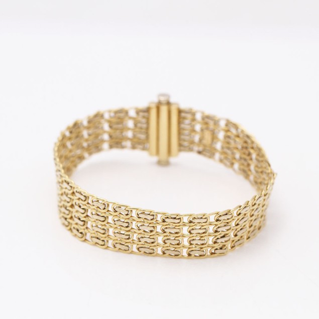 Bracelet en maille d'or bicolore...