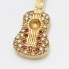 Pendentif guitare en or 18k d'occasion avec zircons