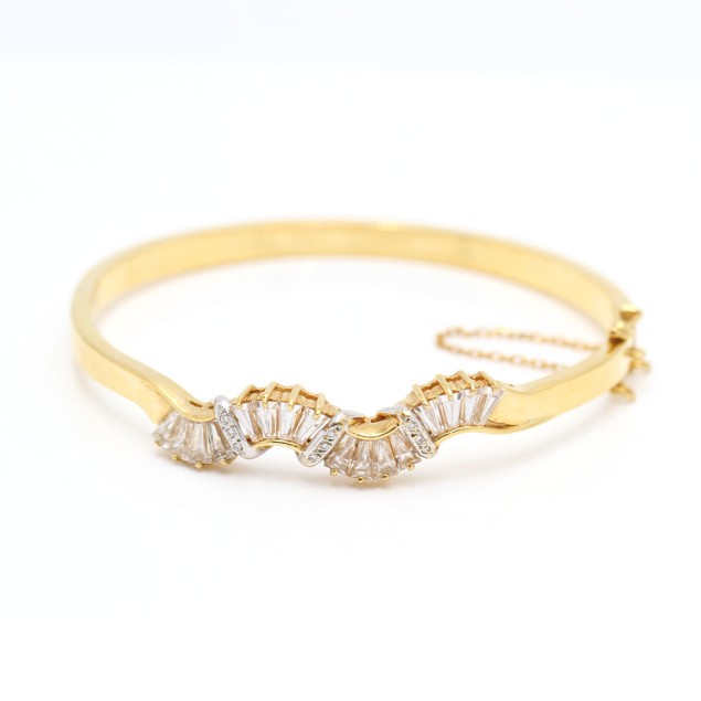 Brazalete ondulado de oro 18k con...