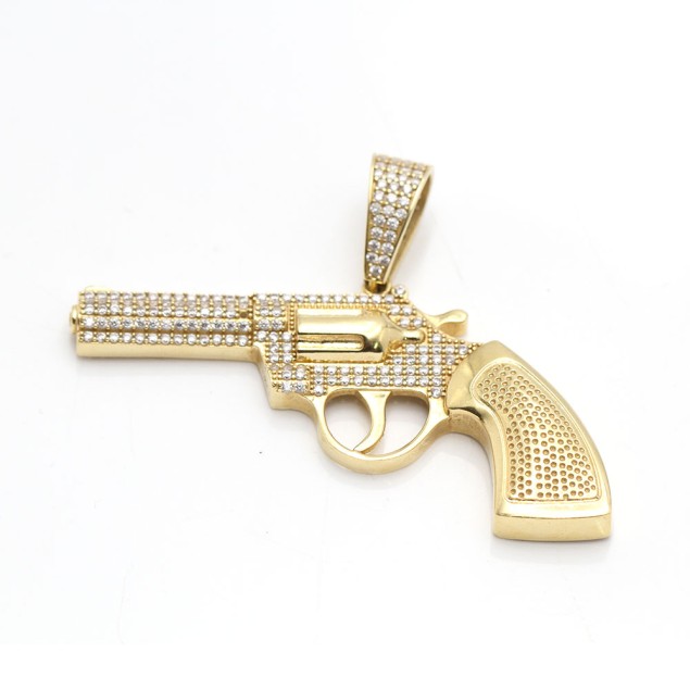 Pendentif revolver en or 18 carats...