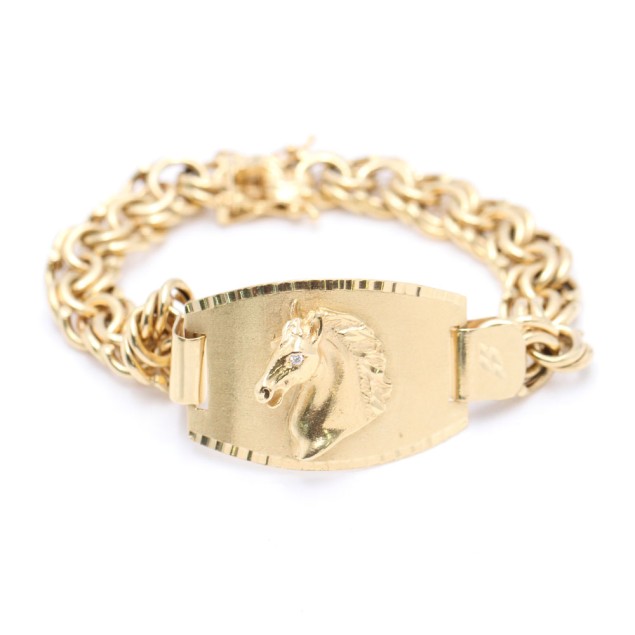 Bracelet en or 18k à motif de cheval...