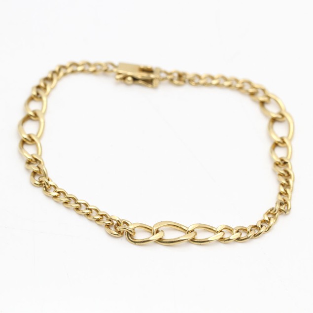 Pulsera alternada maciza de oro 18k...