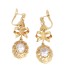 Boucles d'oreilles longues d'occasion en or 18k avec zirconias